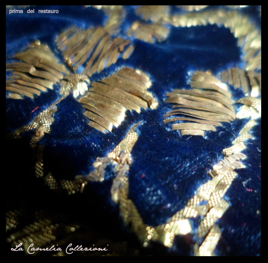 prima del restauro, particolare di lettere in lamina oro applicate sulla parte di velluto