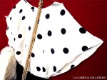vestiti a pois – blusa in seta bianca con pois neri abbinata a gonna a pieghe nera – la camelia&nbsp;collezioni