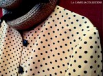 vestiti a pois – giacchina arancio con pois neri abbinata a gonna a pieghe nera – la camelia&nbsp;collezioni
